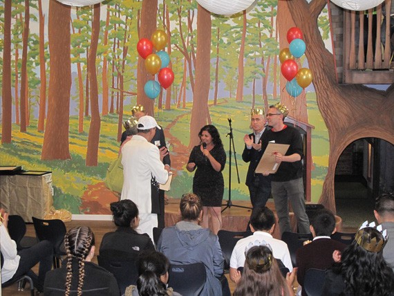 826 Executive Director Extraordinaire Bita Nazarian, presenting INTERSTICE Principals Andrew and Zoee with a thank you gift during the program